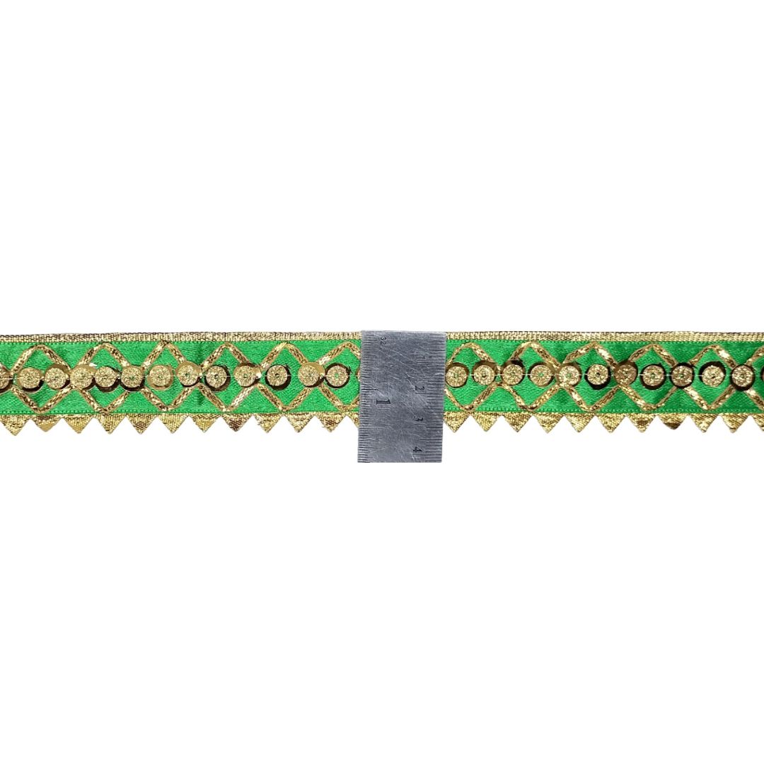 Decorative green ribbon with gold pattern on a white background